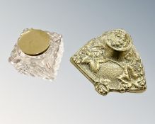 A Victorian glass brass mounted inkwell, together with another brass and ceramic inkwell.