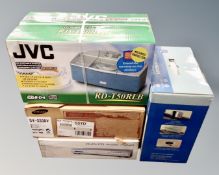 A JVC portable CD player together with a Samsung video cassette player,
