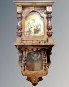 A 19th century continental walnut and beech eight-day wall clock with brass and silvered dial.