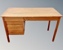A Scandinavian teak single pedestal writing desk fitted with four drawers.