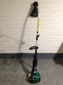A Qualcast petrol strimmer