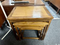 A nest of three Chinese style tables.