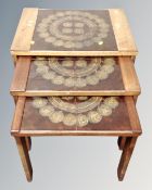 A nest of three mid-20th century tile topped tables.