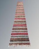 A kilim runner, 551cm by 76cm.