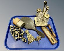 A hip flask, a plated cruet, a thermometer, hand mirror, brass trivet,