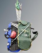 A crate containing a large glass vase containing a large quantity of assorted golf balls,