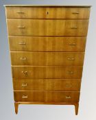 A Scandinavian teak seven drawer chest.