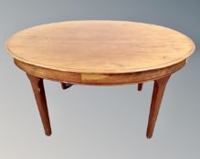 A mahogany oval low coffee table.