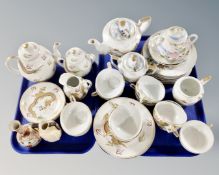 Two trays of two part Japanese gilded tea services together with a Japanese satsuma vase and a twin