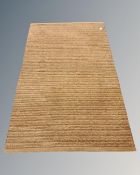 A contemporary rug on brown ground, 129cm by 202cm.