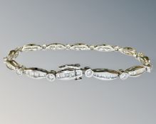 A 18ct white gold diamond bracelet set round and baguette stones, approximately 117 stones,