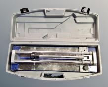 A tile cutter in case.