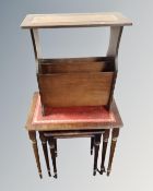 A nest of three tables together with a magazine rack.