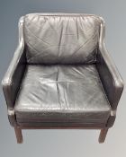 A late 20th century Scandinavian black leather upholstered low armchair.