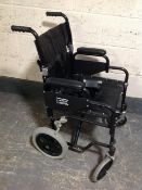 A folding wheel chair with foot rests
