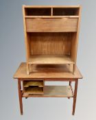 A 20th century teak storage coffee table together with a further teak side cabinet.