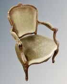 A continental carved beech salon armchair.