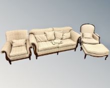 A contemporary four-piece lounge suite comprising of settee,