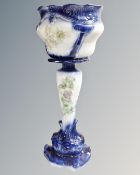 A glazed pottery jardiniere on stand.