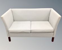 A late 20th century Scandinavian Stouby two seater settee in blue/grey upholstery.