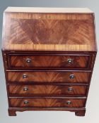 A mahogany fall front writing bureau fitted with four drawers.