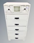 A vintage painted pine seven drawer chest