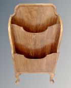 A 1930's walnut magazine rack