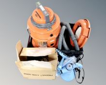 A vax carpet cleaner with hose together with hand held steam cleaner