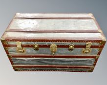 An early 20th century metal bound shipping trunk