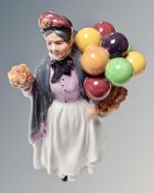 A Royal Doulton figure 'Biddy Pennyfarthing' HN 1843