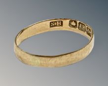 An 18ct yellow gold band ring, 0.9g. CONDITION REPORT: Ring misshaped.