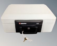 A Sentry 1160 fire resistant cash box with key