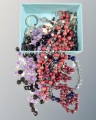 A box of rosary and prayer beads together with crucifixes