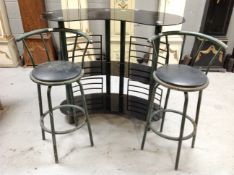 A metal and glass kidney shaped bar together with two high stools
