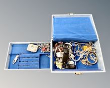A blue box of costume jewellery, miniature purse, lady's watch,