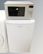 An Electra under bench fridge together with a Panasonic microwave