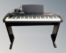 A Roland EP7 II E electric piano on stand,