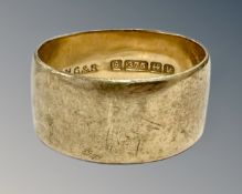 A 9ct yellow gold thick band ring, 6.5g size Q.