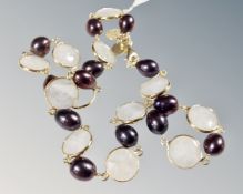 A silver gilt necklace with alternate faceted stones