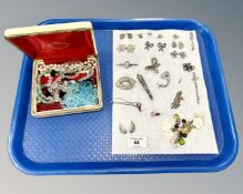 A collection of costume jewellery, white metal brooches,