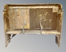 An antique reclaimed pine hall settee