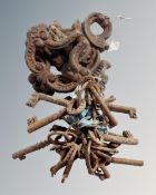 A box of 19th century cast iron door knocker together with a quantity of antique keys