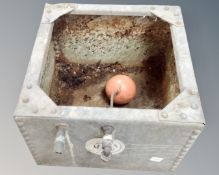 A galvanized metal water tank