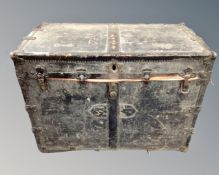 An antique metal bound shipping trunk