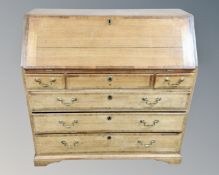 A 19th century Continental oak bureau with six drawers