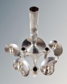 A mid century Nagel three way candle holder together with four Danish prima kidney shaped candle