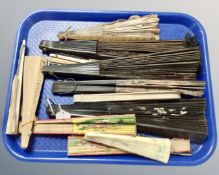 A tray of vintage hand fans