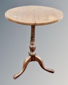 A 19th century circular pedestal wine table