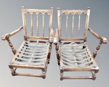 A pair of Ercol low armchairs in antique finish (no cushions)