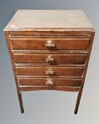 An Edwardian four drawer music chest containing sheet music